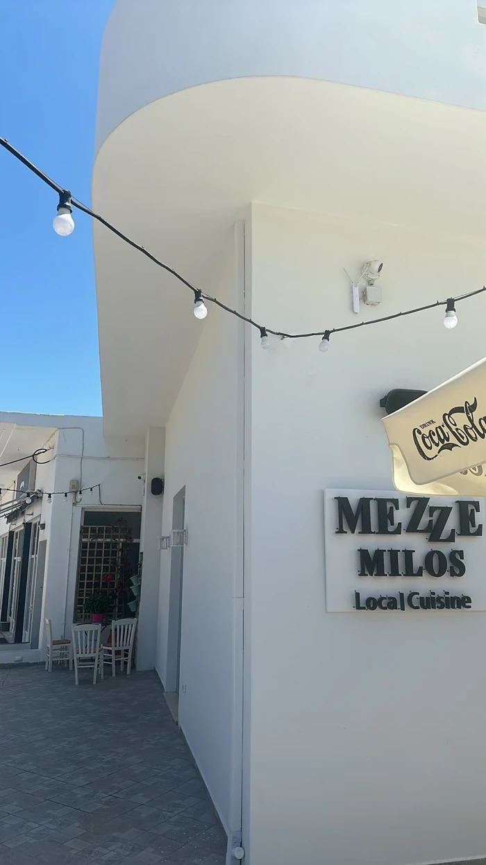Mezze Milos restaurant sign in Milos